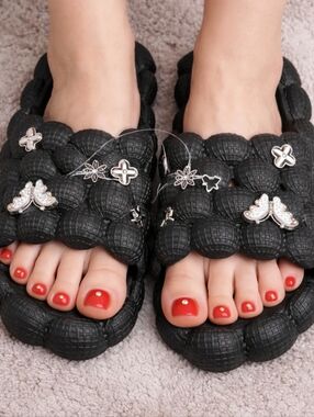 Bubble slide foam sandals with charms.